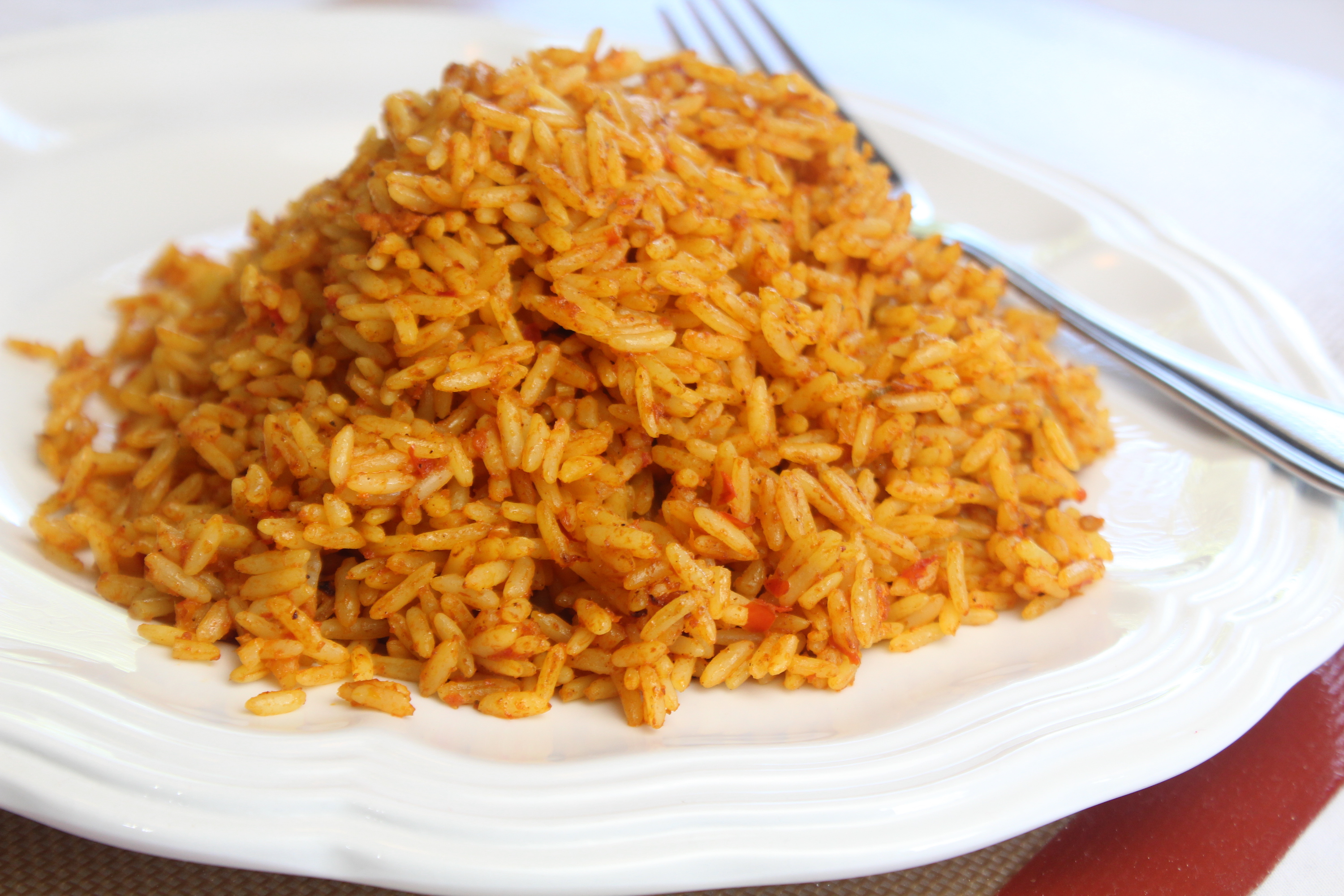 write an expository essay on how jollof rice is prepared